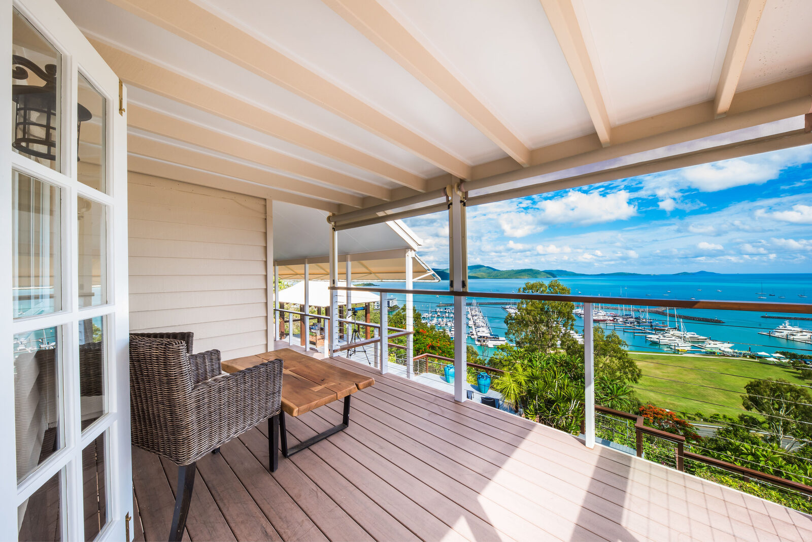 Covered balcony with marina and island views