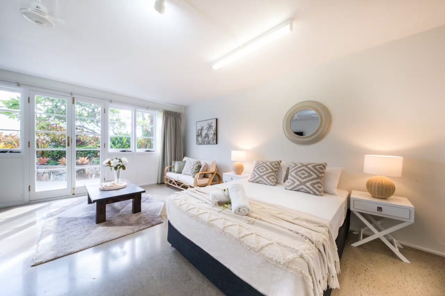 Large downstairs retreat with queen bed and private lounge