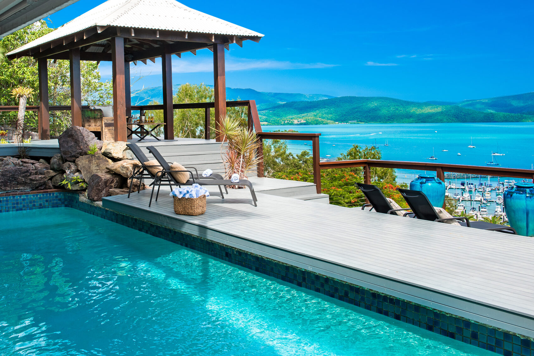 Pool, poolside gazebo and deck overlooking Coral Sea Marina